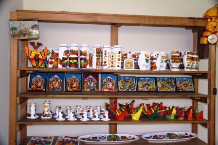 Shelf of art products in Llort's San Salvador gallery