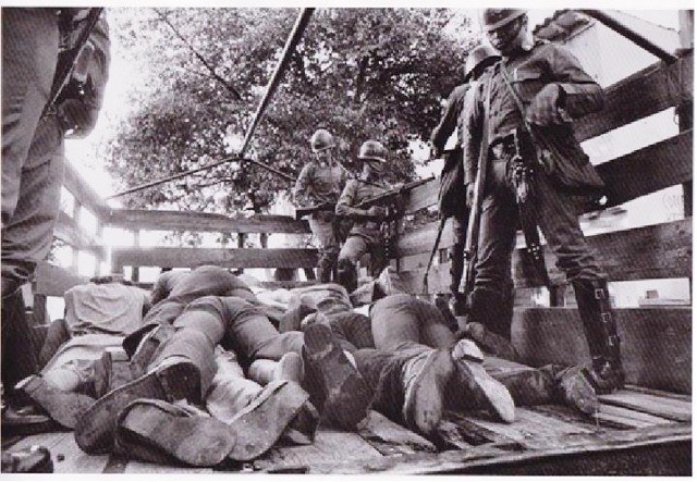 A truck bed with bodies of civilians 1980