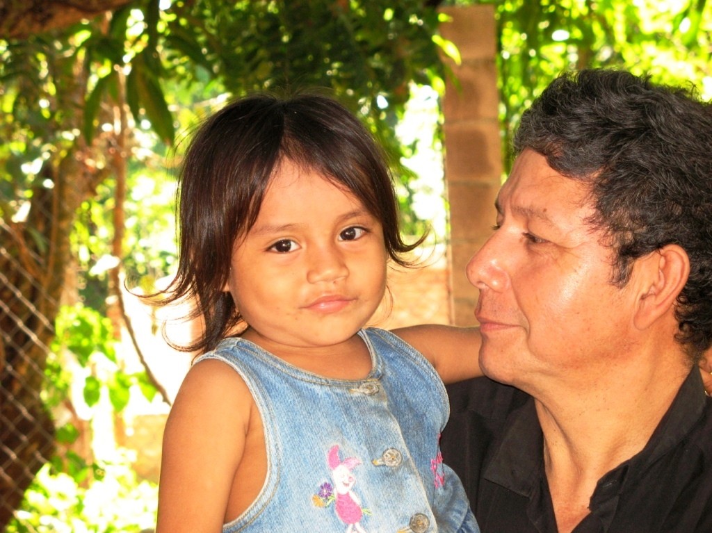 Pastor Luis provides company and affection for a parentless child.