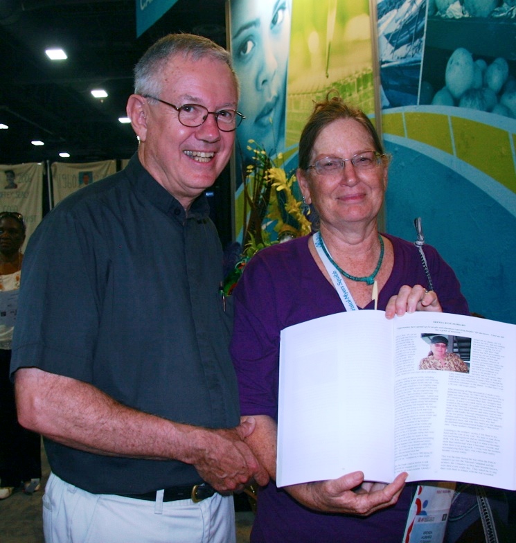 Brenda welcomes Don Seiple, Pastor Emeritus, to the Global Village at the International AIDS CONFERENCE in D.C. where a book with the story of her years of amazing service is presented.